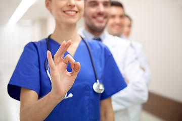 Image showing close up of doctors at hospital showing ok sign