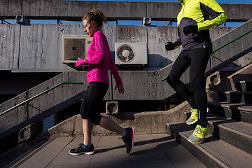 Image showing young  couple jogging on steps