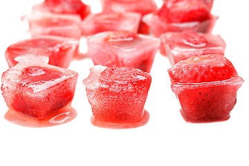 Image showing Three rows of strawberries in ice