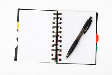 Image showing notepad with pen isolated