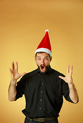 Image showing The screaming christmas man wearing a santa hat