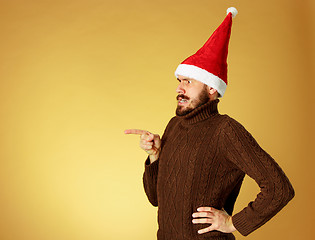 Image showing The serious christmas man wearing a santa hat