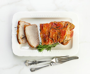 Image showing sliced roasted pork on white plate