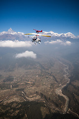 Image showing Ultralight trike and plane fly over Pokhara and Annapurna region