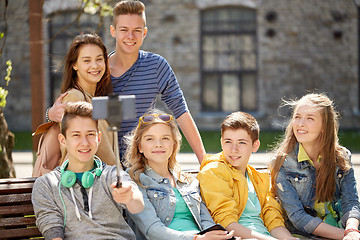 Image showing happy teenage students taking selfie by smartphone