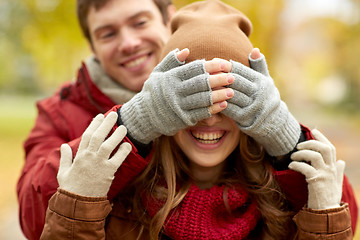 Image showing happy young couple having fun in autumn park