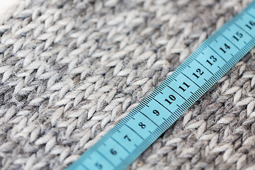 Image showing close up of knitted item with measuring tape