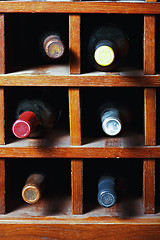 Image showing Cells with six wine bottles