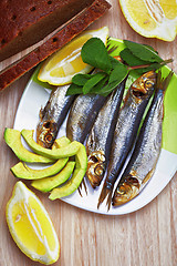 Image showing Smoked sprat fish with bread