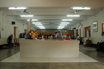 Image showing Pilgrims pray beside the tomb of Mother Teresa in Kolkata, West Bengal, India 