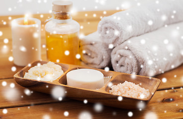 Image showing soap, himalayan salt, scrub in bowl, towel and oil