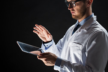 Image showing close up of doctor or scientist with tablet pc