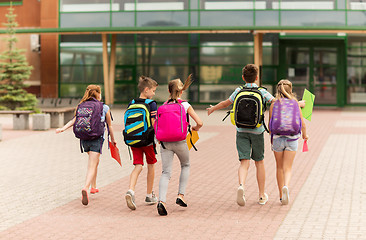 Image showing group of happy elementary school students running