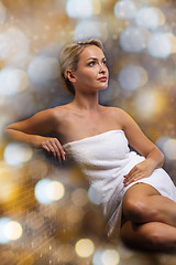 Image showing beautiful young woman sitting in bath towel