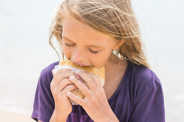 Image showing A hungry girl with an appetite for eating pie