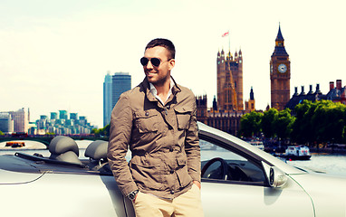 Image showing happy man near cabriolet car over london city