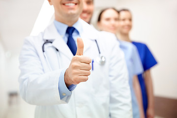 Image showing close up of doctors at hospital showing thumbs