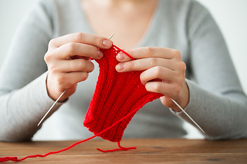 Image showing woman hands knitting with needles and yarn