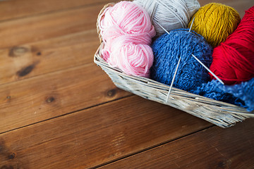 Image showing basket with knitting needles and balls of yarn