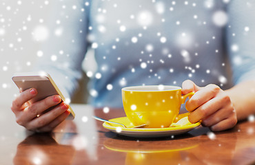 Image showing woman with smartphone and coffee cup