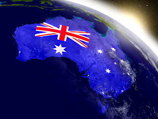 Image showing Australia with flag in rising sun