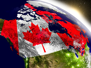 Image showing Canada with flag in rising sun