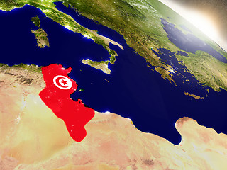 Image showing Tunisia with flag in rising sun