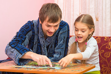 Image showing Dad and daughter are happy that you have found a place for the next mosaic element