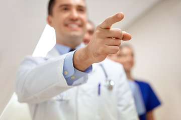 Image showing close up of doctor pointing finger at hospital