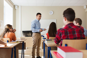 Image showing group of students and teacher with test results