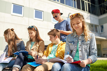 Image showing group of students with notebooks at school yard