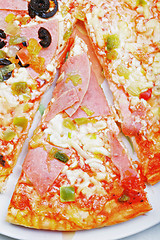 Image showing Slice of ham pizza on plate