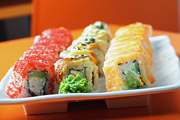 Image showing Set of sushi rolls on the cafe table