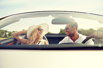 Image showing happy man and woman driving in cabriolet car