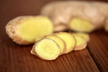 Image showing close up of ginger root on wooden table