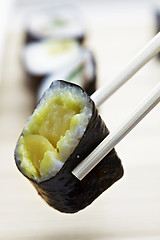 Image showing Roll and chopsticks