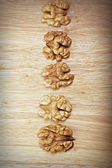 Image showing Row of walnuts above view