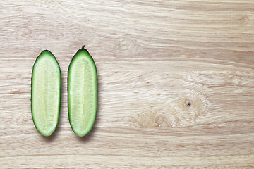 Image showing Two halves of cucumber