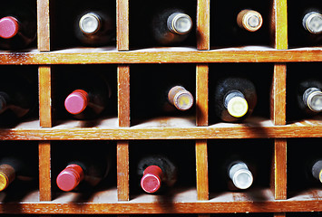Image showing Wine bottles in cells