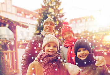 Image showing happy family over city christmas tree and snow