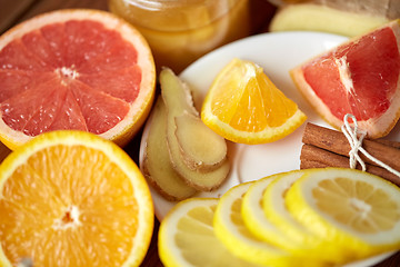 Image showing honey, citrus fruits, ginger and cinnamon