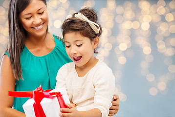 Image showing happy mother and child girl with gift box