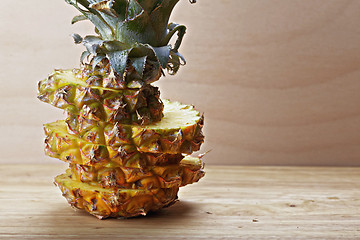 Image showing Sliced pineapple on cutting board
