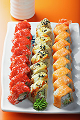 Image showing Set of sushi rolls and saucer