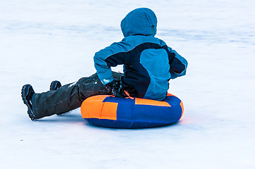 Image showing Baby winter sledding on the Ural River.