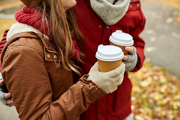 Image showing close up of happy couple with coffee in autumn