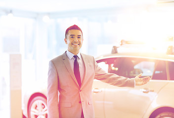 Image showing happy man at auto show or car salon