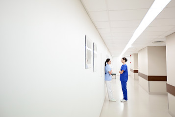 Image showing female doctors or nurses talking at hospital
