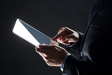 Image showing close up of businessman with transparent tablet pc