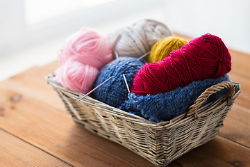 Image showing basket with knitting needles and balls of yarn